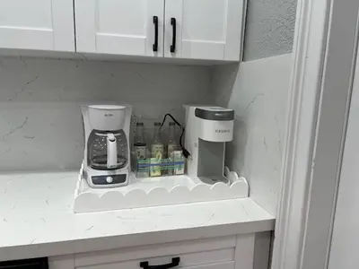 a kitchen counter with a coffee maker on a shelf at 3 Bed - Sleeps 6 - Free Parking - 5 Mins to Beach in Hollywood