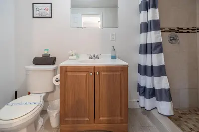 a bathroom with a toilet and a sink at COZY Private Apts in Hollywood By Hard Rock Casino! in Hollywood