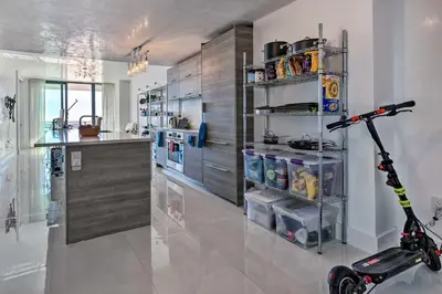 a kitchen with a scooter in the middle of a room at Luxe Miami Condo with Community Pool and Hot Tub! in Miami
