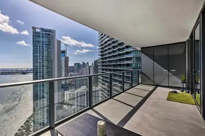 an apartment balcony with a view of the city at Luxe Miami Condo with Community Pool and Hot Tub! in Miami