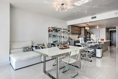 a living room with a table and a couch at Luxe Miami Condo with Community Pool and Hot Tub! in Miami