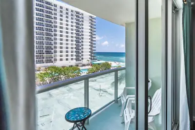a balcony with a view of the beach and the ocean at Dream Vacation Apartment Right On The Beach in Hollywood