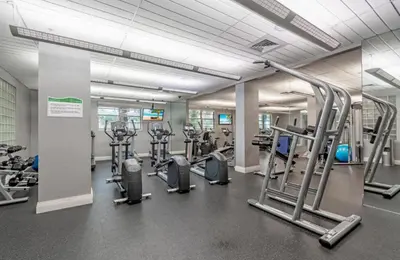a gym with several treadms and cardio machines at Dream Vacation Apartment Right On The Beach in Hollywood