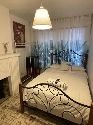 a bedroom with a large bed and a fireplace at Habitacion Centrica Calle 8 Miami (2) in Miami