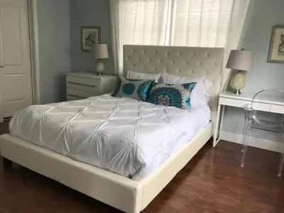 a bedroom with a white bed and a desk at Sun Sand and Love - Lovely 2 Beds, 2 Bath Condo in Miami Beach