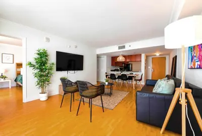 a living room with a couch and a table at Trendy 2BR Condo with Pool and Bay Views in Miami