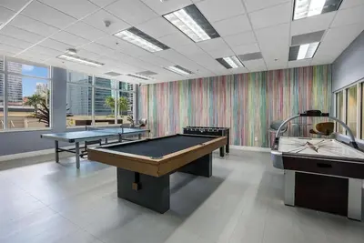 a room with two ping pong tables in it at Beautiful 3 bedroom apartment in Brickell Miami in Miami