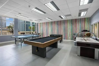 a room with two ping pong tables in it at Beautiful 3 bedroom apartment in Brickell Miami in Miami
