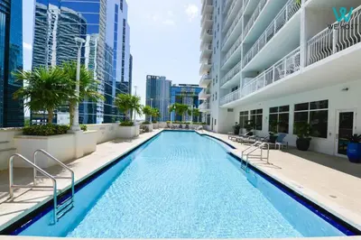 a swimming pool in the middle of a building at Amazing 3BR Condo at Brickell with City Views in Miami