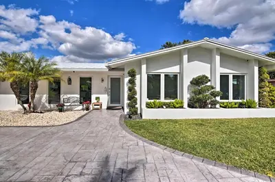 a house with a patio and a driveway at Miami Home Outdoor Pool with Slide and Fire Pit! in Kendall
