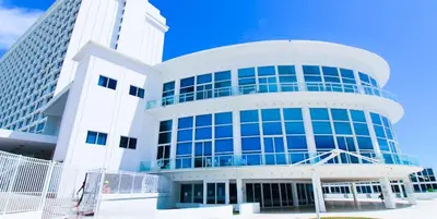 a large white building with blue windows at Castle 1131 in Miami Beach