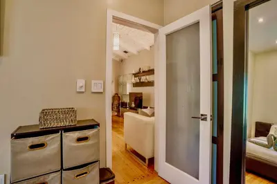 a room with a door leading to a living room at Entire private Beautiful 2 Bedroom plus Den House with gated front&back yard and Free parking 10min drive to Miami Beach in Miami