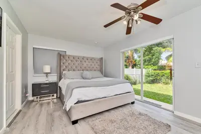 a bedroom with a bed and a ceiling fan at Hard Rock Hidden Gem! in Miami Gardens