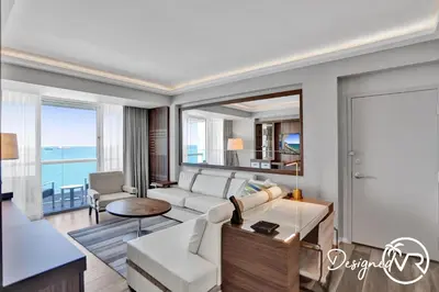 a living room with a couch and a table at 1BR condo w hot tub gym access in Fort Lauderdale
