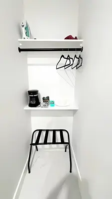a shelf in a white room with glasses on it at Private Rooms close to Miami Airport - Free parking - 01 in Miami