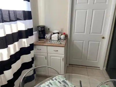 a kitchen with a white door and a counter top at Private Room near Miami Airport - Free parking - 01 in Miami