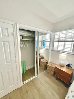 a bedroom with a closet with a mirror at Comfy BNB w/ King Bed + Work/Travel + Beach 8 Min in Hallandale Beach