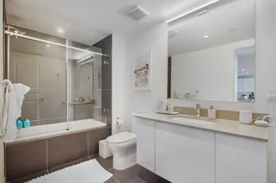 a bathroom with a toilet and a shower and a sink at Lunabase Heavenly View in Miami