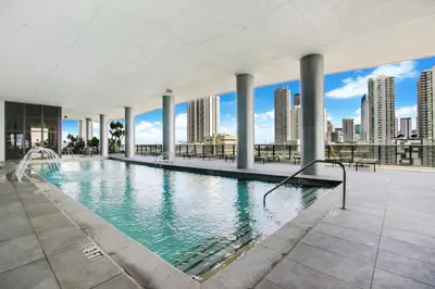 an indoor swimming pool with a view of the city at Lunabase Heavenly View in Miami