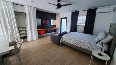 a bedroom with a bed and a desk and a chair at Casa Cuba in Little Havana, Brickell, Calle 8 and 10 minutes to the Beach FREE PARKING in Miami