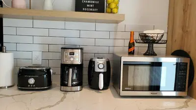a kitchen counter with a microwave and other appliances at Casa Cuba in Little Havana, Brickell, Calle 8 and 10 minutes to the Beach FREE PARKING in Miami