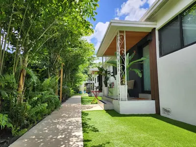 a garden rendering of a house with a lawn at Casa Cuba in Little Havana, Brickell, Calle 8 and 10 minutes to the Beach FREE PARKING in Miami