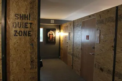 a hallway with a door with a sign that reads shut just zone at Hotel Gaythering - Gay Hotel - All Adults Welcome in Miami Beach