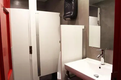 a white bathroom with a sink and a mirror at Hotel Gaythering - Gay Hotel - All Adults Welcome in Miami Beach