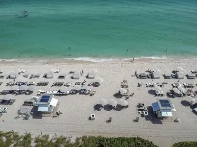 an overhead view of a beach with chairs and umbrellas at Junior Suite 2 at Sorrento Residences- Miami Beach home in Miami Beach
