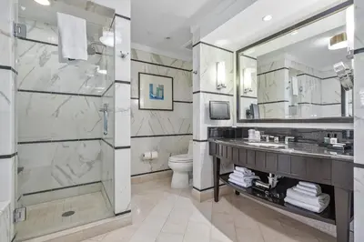 a bathroom with a shower and a sink and a toilet at Junior Suite 2 at Sorrento Residences- Miami Beach home in Miami Beach