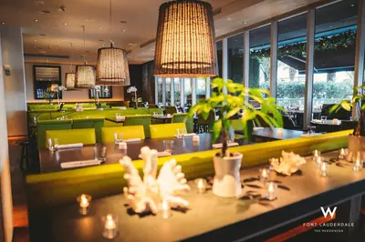 a restaurant with a dining room with tables and chairs at Stylish 1 BR at Fort Lauderdale in Fort Lauderdale