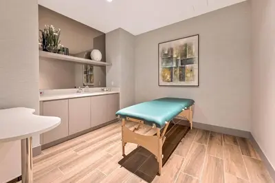 a room with a table with a bench in it at Luxury 1BD/1BT Apartment in Downtown Doral in Miami