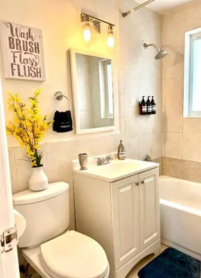 a bathroom with a toilet and a sink and a tub at Enchanting cozy Apartment 10 min away from airport, Calle 8, Brickell, Coral Gables, the beach and more! in Miami