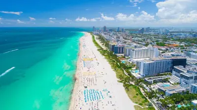 an aerial view of a beach and the ocean at Luxurious Private Condo at 1 Hotel & Homes -945 in Miami Beach