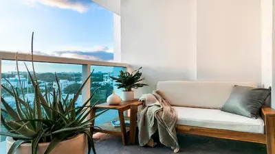 a living room with a couch and potted plants at Luxurious Private Condo at 1 Hotel & Homes -945 in Miami Beach