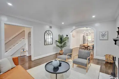 a living room with a couch and a table at Beach House w/ Heated Pool in Hollywood