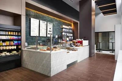 a bakery with a counter with pastries on it at Loews Coral Gables Hotel in Miami