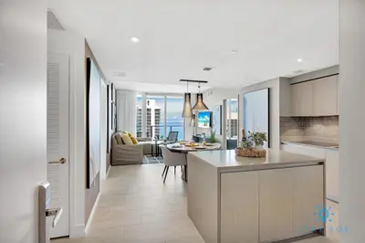 a kitchen and living room with a view of the ocean at Oceanfront View - Balcony - Hot Tub - Gym in Hollywood