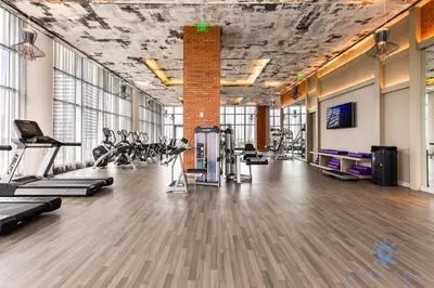 a gym with treadmills and cardio equipment in a room at Oceanfront View - Balcony - Hot Tub - Gym in Hollywood