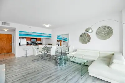 a living room with a white couch and a glass table at Amazing Penthouse In beautiful Brickell 42 floor!! Free Garage Parking in Miami