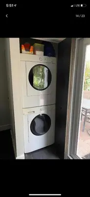 a washing machine with a tv on top of it at HEART OF WILTON MANORS in Fort Lauderdale