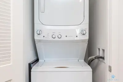 a white washer and dryer in a kitchen at Wrap Around Balcony, Paradise Beach & Amazing Pools in Hollywood