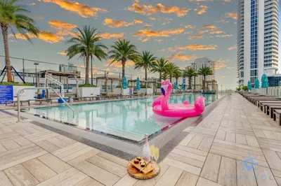 a pool at a resort with a pink swan in the water at Wrap Around Balcony, Paradise Beach & Amazing Pools in Hollywood