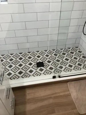 a bathroom with a white and black tiled wall at Modern Spanish Villa- Pool- By River-Tropical !!! in Fort Lauderdale