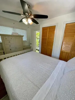 a bedroom with a bed and a ceiling fan at Downtown FTL apartments on the River in Fort Lauderdale