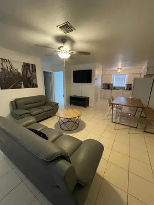a living room with a couch and a table at Cozy Downtown Apartments on Water in Fort Lauderdale