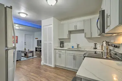 a kitchen with white cabinets and a counter top at Beautiful Miami Getaway Less Than 6 Mi to Downtown! in Miami