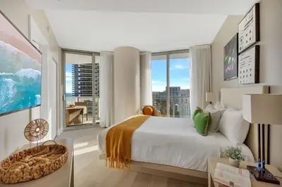 a bedroom with a large bed and a large window at Insane Ocean View Balcony - Beachfront Resort - Pools in Hollywood