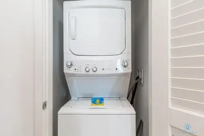 a white washer and dryer in a room at Insane Ocean View Balcony - Beachfront Resort - Pools in Hollywood