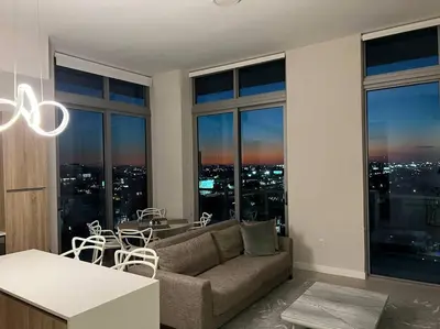 a living room with a couch and a table at BRAND NEW TOP FLOOR IN THE HEART OF MIAMI in Miami